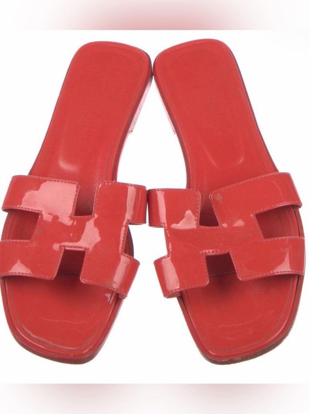Hermès Oran Sandals red patent calfskin leather featuring the iconic "H" cutout